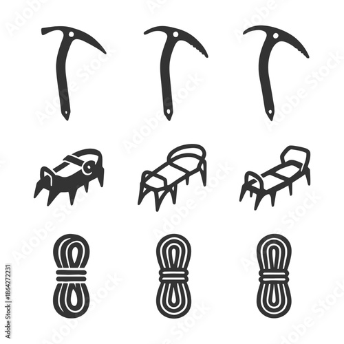 Collection of ice axes, crampons, and climbing ropes for alpine adventures.