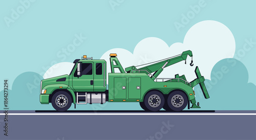 Large green tow truck with a powerful crane arm parked on a roadside against a light blue sky with fluffy white clouds.