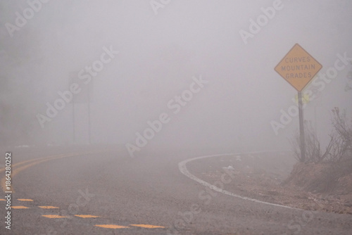 A foggy winding road in the mountains