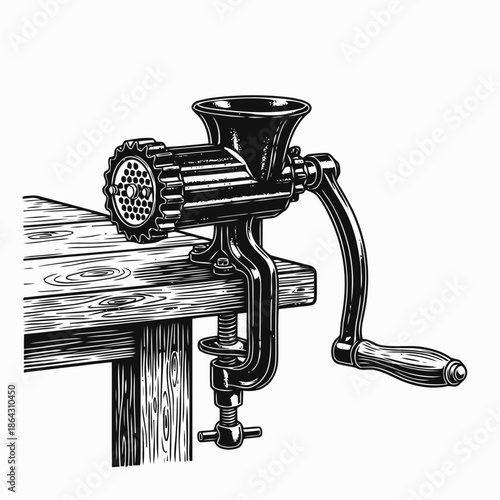Vintage Meat Grinder Mounted On Wooden Table