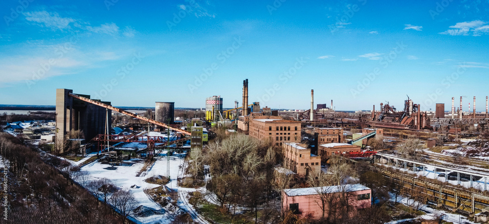 Fototapeta premium Industrial steel plant in winter landscape
