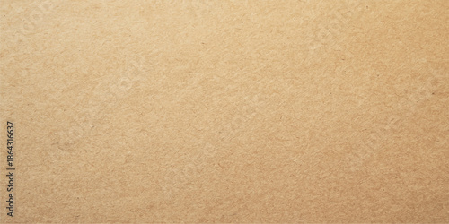 A vintage brown cardboard texture background featuring a rough recycled kraft paper pattern on a blank aged carton surface