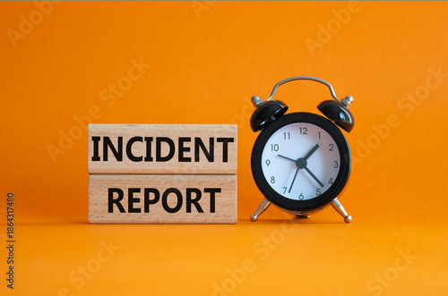 Incident Report symbol. Concept word Incident Report on wooden blocks. Beautiful orange background. Business and Incident Report concept. Copy space