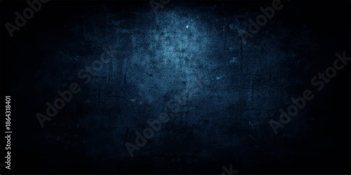 A dark blue grunge background with an old textured concrete wall pattern creates a blank vintage stone surface for a dirty chalkboard backdrop design
