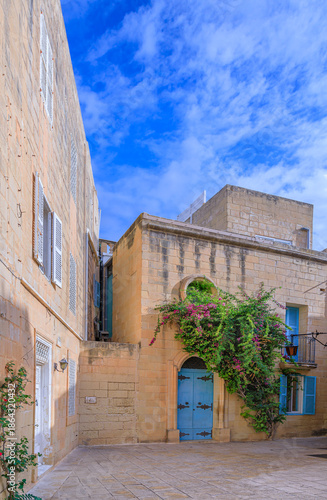 Urban view of Mdina, Malta: view of typical narrow street with Maltese house.