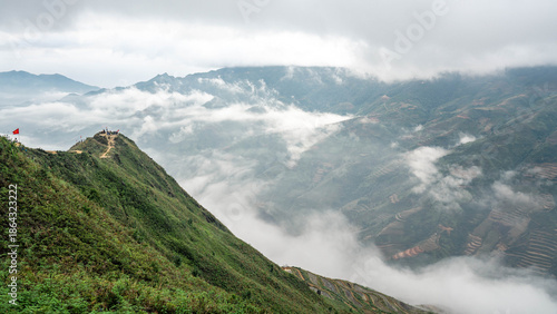 Mountain ridge and clouds over terraced valley in northern Vietnam