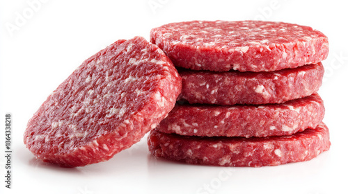 Raw ground beef hamburger patties that have just been prepared are isolated.