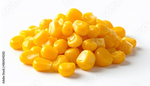 Close-up of a vibrant pile of cooked corn kernels against a clean white backdrop
