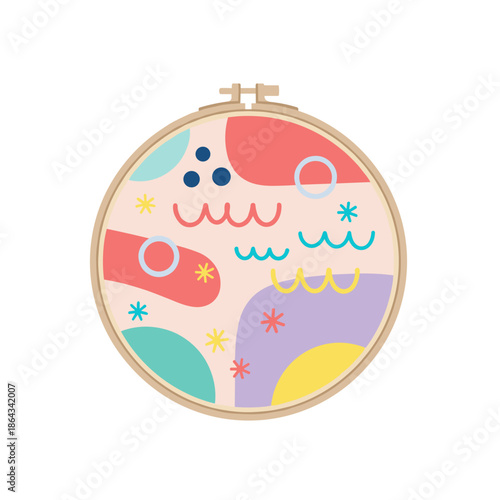 Colorful embroidery hoop with abstract designs and playful patterns  
