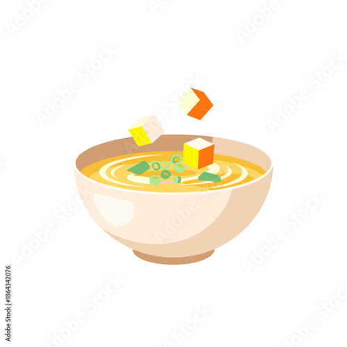 Bowl of miso soup with tofu cubes and green onions floating  