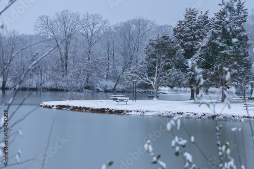 river in winter with bench