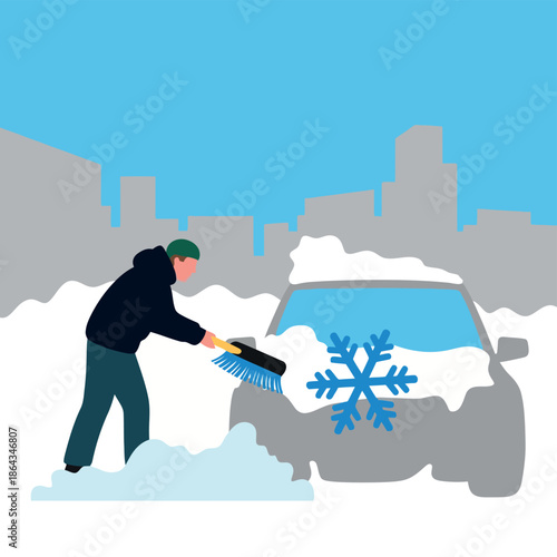 Man uses a brush to clear heavy snow and a large blue snowflake from a car windshield outside.