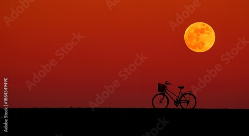 Bicycle Silhouette Under Full Moon in Red Sky Night Landscape