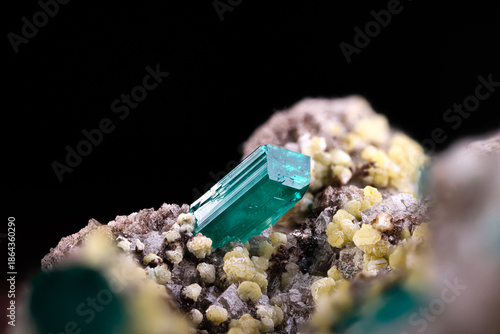 Dioptase crystal on Mimetite and dolomite. Specimen from Gautala, Mindouli district, Republic of Congo. Micro photography extreme close-up. microscope mineral crystal photography