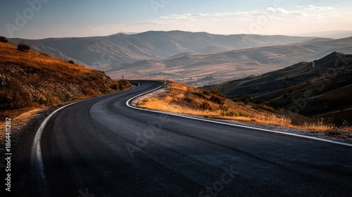 an expansive landscape with a paved road stretching into the distance