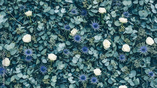 Eucalyptus leaves and white roses create a lush, natural backdrop for a wedding or event, evoking a sense of romance and elegance.