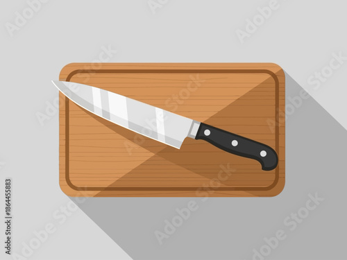 Kitchen Essentials A Sharp Chef's Knife Resting on a Wooden Cutting Board, Ready for Culinary Tasks