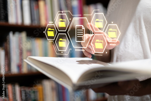 Bilde på lerret Digital file management concept with virtual folder icons hovering over an open book in a library, representing data organization, archiving document digitization technology