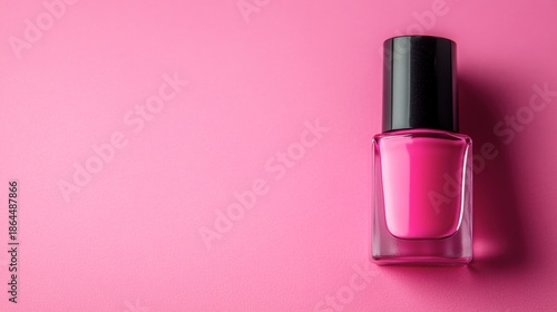 Vibrant Pink Nail Polish Bottle on a Soft Pink Background