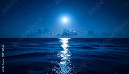 Serene night ocean scene with a bright moon reflecting light across the dark waves