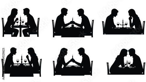 Couple enjoying romantic dinner together in restaurant silhouette