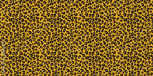 Vibrant yellow leopard print pattern with black spots