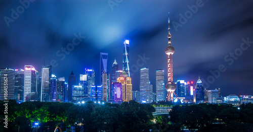 Wallpaper Mural Shanghai skyline at night with illuminated skyscrapers and Orien Torontodigital.ca