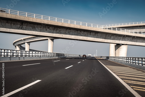 Schilderij op canvas Multi-level Concrete Highway Overpass with Car