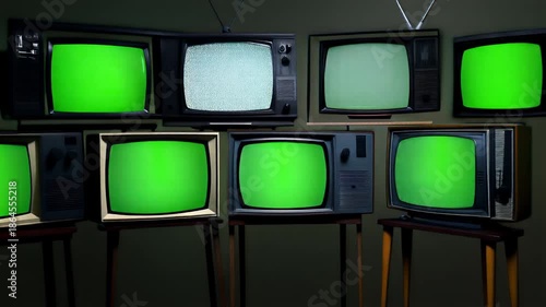 Retro Television Screens Displaying Bright Green Screens in a Dark Studio Environment