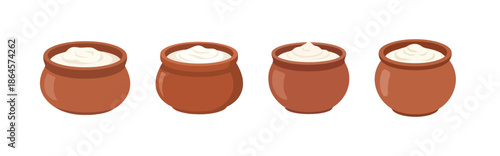 Four terracotta pots filled with creamy white yogurt or curd, showcasing a traditional dairy product in simple earthenware containers