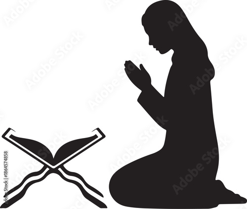 Silhouette of a person praying with an open book beside them
