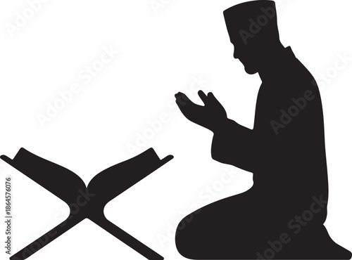 Silhouette of person praying with open book in front