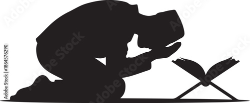 Silhouette of person praying with open book in front 1
