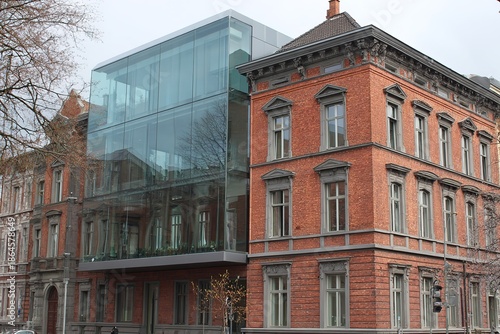 Historic Red Brick Building With Modern Glass Extension, Architectural Style Fusion
