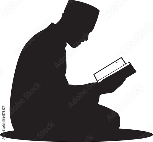 Silhouette of person reading book while kneeling