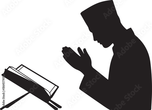 Silhouette of person praying with book on stand hands
