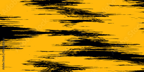 Abstract grunge texture background with dynamic black brush strokes scattered across a vibrant yellow surface