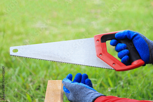 short saw on worker hand prepare for using in wood work
