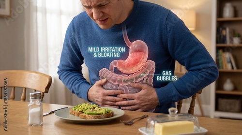 Man experiencing stomach pain and bloating after eating avocado toast with anatomical digestive system overlay graphic