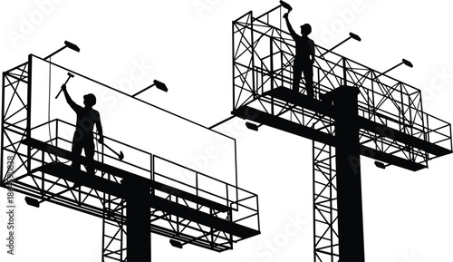 Black silhouette of industrial workers on high scaffolding maintenance platforms installing or cleaning large commercial outdoor billboard signs on tall metal poles.