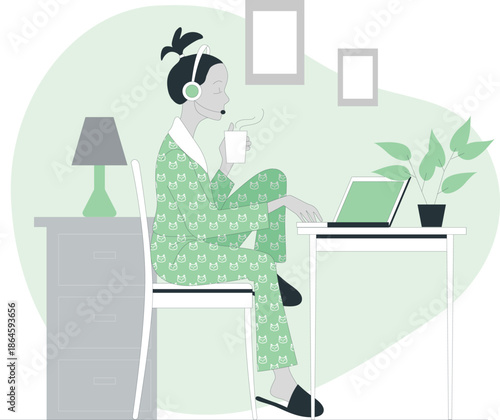 Woman sitting at desk with laptop and drinking coffee in a serene home environment