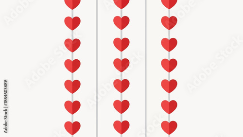 Three vertical strings of red hearts hanging against a white backdrop, viewed from a straight-on perspective