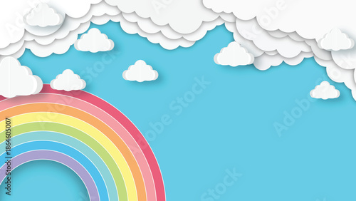 A vibrant papercraft rainbow arcs beneath fluffy white clouds on blue