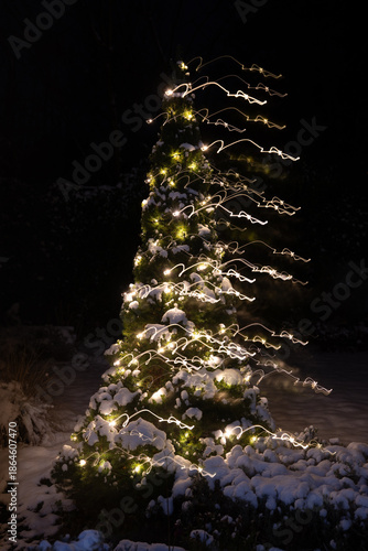 Christmas tree with white lights and snow