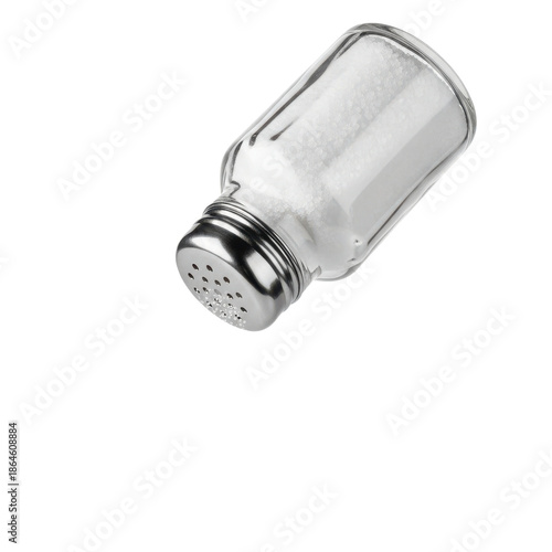 Clear glass salt shaker with white crystals on black