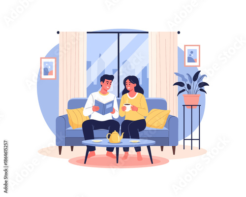 A couple relaxing on a sofa, reading a book and drinking tea in a cozy living room.