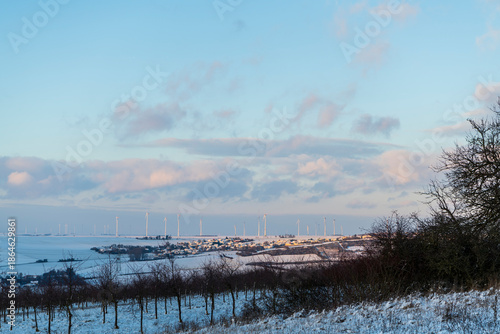 village and wind turbines in winter