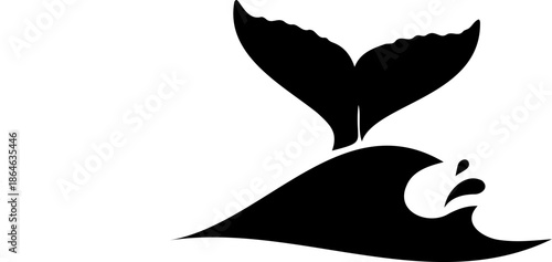 Whale tail silhouette over waves