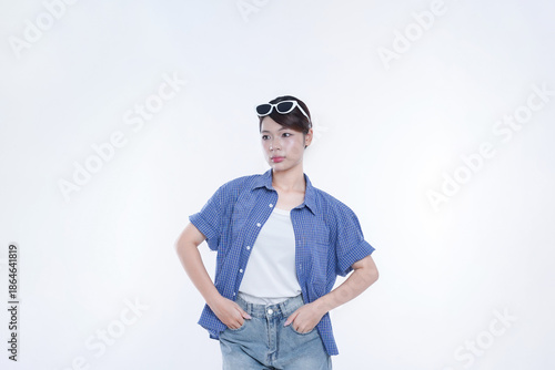 The young girl is photographed against a white background