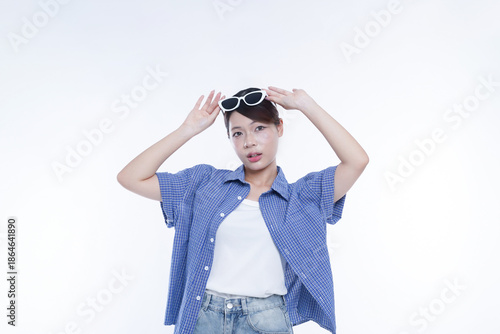 The young girl is photographed against a white background